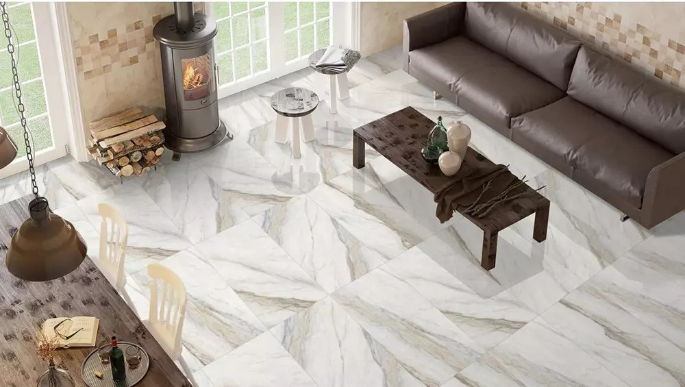 Large-format marble-look porcelain tile flooring in a modern living room with clean lines and natural light